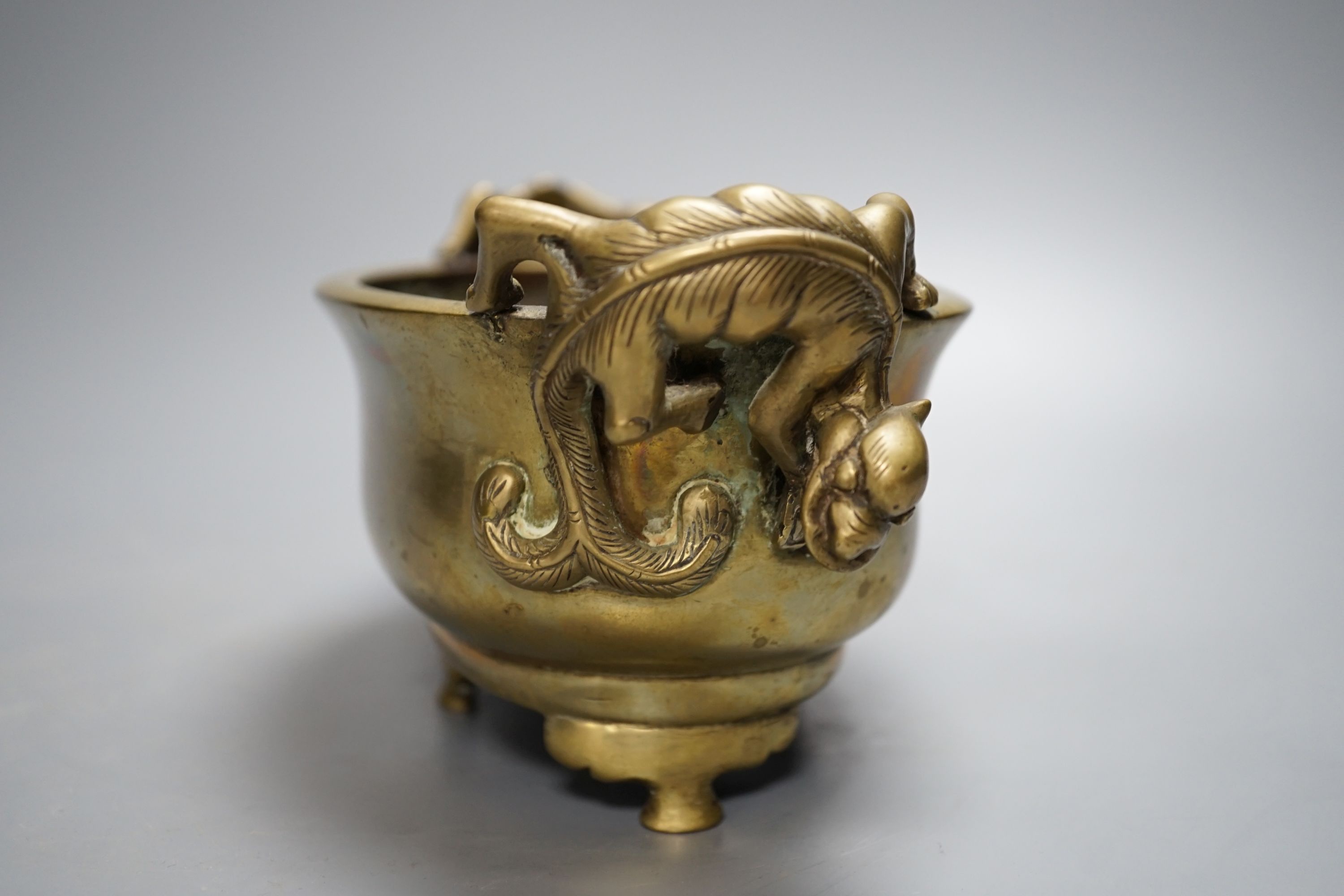 A 19th century Chinese bronze censer with ‘dragon’ handles, Xuande mark, 26cm